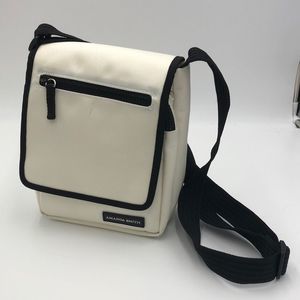 White crossbody bag with black trim by Amanda Smith Adjustable strap